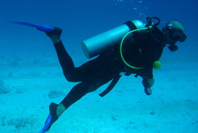 Adventure seekers enjoying scuba diving in the clear waters of Gokarna.